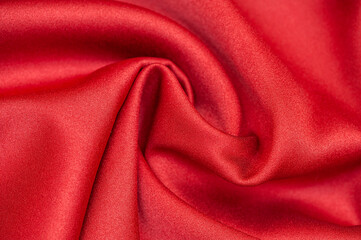 Red satin fabric. Fabric background