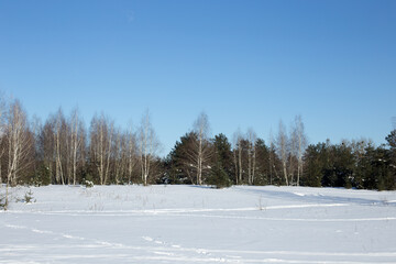 Winter landscape, blue skies and sparkling snow