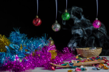 Close up of balls on the Christmas tree. New year concept.incense smoke.