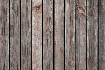 The texture of natural materials. Boardwalk pier on the river bank in the rain and sun	