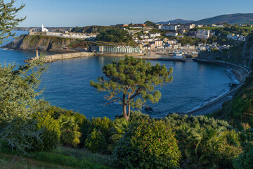 View of the Asturian city of Luarca. In the background the lighthouse and the picturesque cemetery by the sea. 