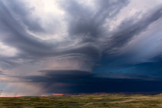 Supercell storm clouds over a field in Wyoming