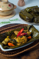 Pepes chicken. Pepes is a traditional cooking method from Indonesia using banana leaf as food wrapping, and then steamed or grilled it.