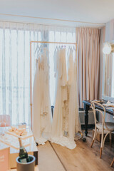 luxury hotel room with wedding dresses on a rack