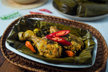 Pepes chicken. Pepes is a traditional cooking method from Indonesia using banana leaf as food wrapping, and then steamed or grilled it.