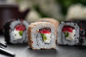 Chess Roll sushi . Traditional delicious fresh sushi roll set with reflection . Sushi menu. Japanese kitchen, restaurant.