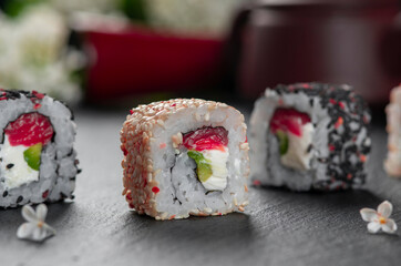 Chess Roll sushi . Traditional delicious fresh sushi roll set with reflection . Sushi menu. Japanese kitchen, restaurant.