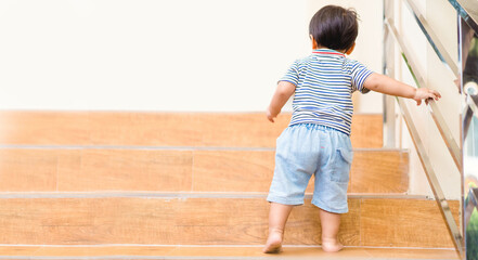 kid on stairs.Child development milestones.growth step.Gross Motor on baby child.baby boy climbing...