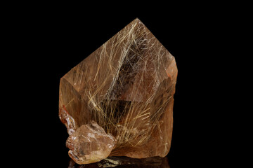 Macro stone mineral Rutile in quartz on a black background
