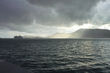 storm with ray of light in the gulf of la spezia