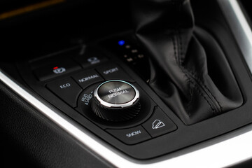 Modern car drive mode selector. Suspension and wheel drive control panel. Driving mode switch...