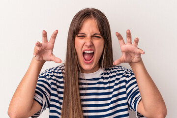 Young caucasian woman isolated on white background showing claws imitating a cat, aggressive gesture.