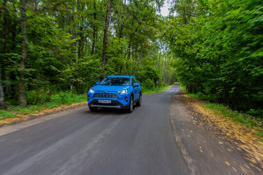 MOSCOW, RUSSIA - SEPTEMBER 9, 2021 Toyota RAV4 (XA50), a compact crossover SUV car model year 2021 on nature background. Toyota RAV4 in motion view.