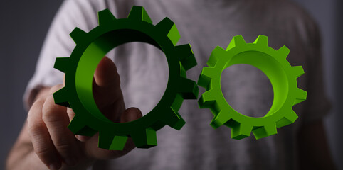 Mechanism green gears and cogs at work on black background. Industrial machinery. 3D illustration. 3D high quality rendering.