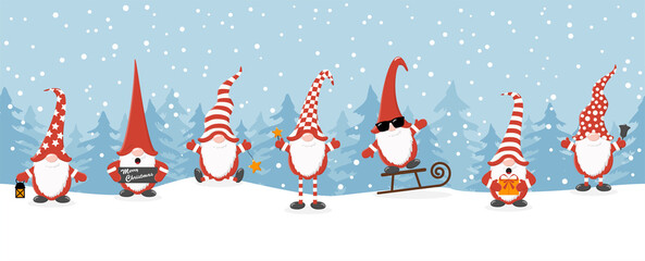 Fototapeta na wymiar christmas gnomes with winter firs background