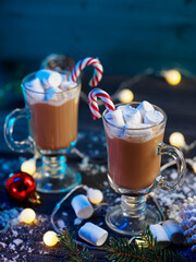 Hot chocolate with marshmallows and candy cane. Christmas and winter traditional drink