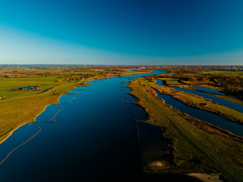 Aerial drone view of the beautiful river in the Netherlands, Europe. Shot at over De Lek river in the Netherlands