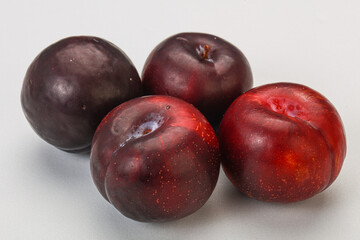 Ripe sweet plum fruit heap