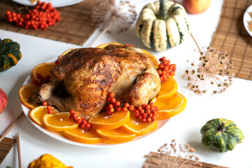 Fototapeta na wymiar Traditional festive dinner with delicious roasted turkey served on table