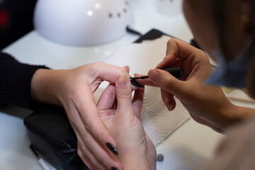 Close up of process manicure at beauty salon.