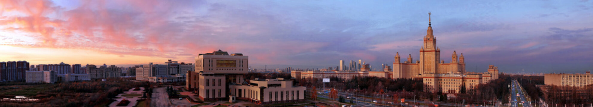Wide angle aerial panorama of autumn campus of Moscow University under dramatic sunset cloudy sky