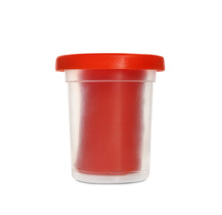 Plastic container of red play dough isolated on white