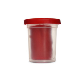 Plastic container of red play dough isolated on white