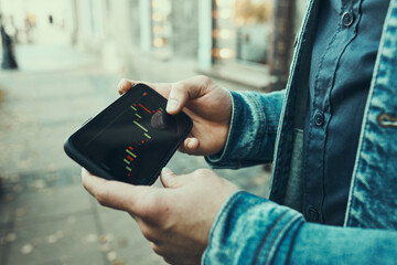 Man investing trading on stock cryptocurrency market using investing application on smartphone....