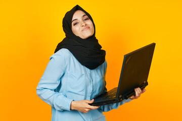 cheerful woman with laptop in hands technology emotions isolated background