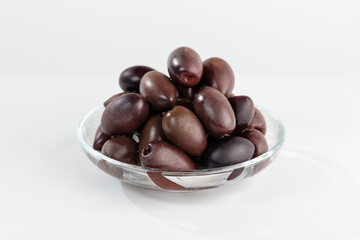 Dark big olives isolated on white background