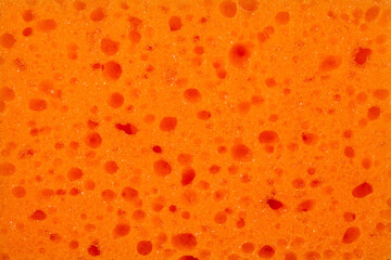 texture orange porous washing sponge close-up for design