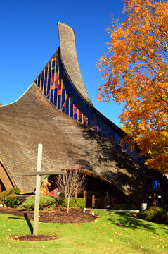 Autumn foliage frames a modern church in New England
