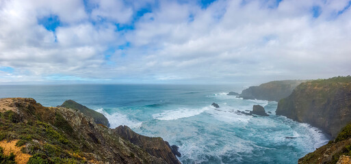 View on big waves comming in at the atlantic ocean coastline on the western algarve in soutern portugal