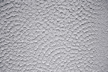 Texture white wall with relief plaster. Front view