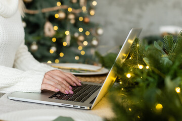 woman online with laptop at home in the living room