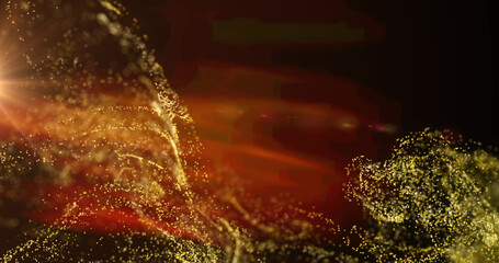 Image of yellow particle cloud and orange light moving on black background