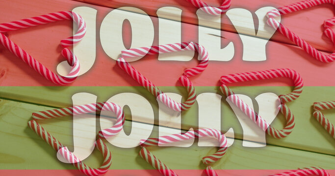Image of jolly text on red and green stripes over christmas candy canes