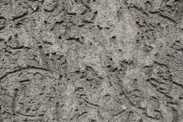 View of the gray texture of the wall of a building or structure, background.