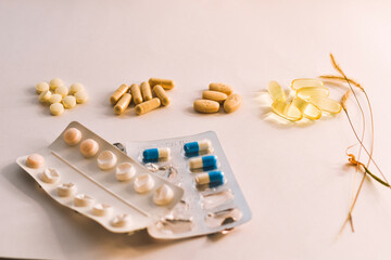 Fototapeta na wymiar pills and capsules vitamins on white background