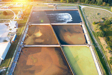 Top aerial view of purification tanks of modern wastewater treatment plant