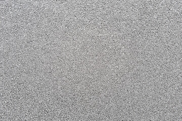 Smooth, uniform surface of decorative quartz sand of silver color