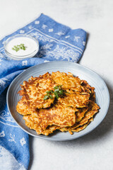 Potato pancakes Latkes on white table background. Traditional Jewish festive food for Hanukkah holiday. Jew festival of lights.