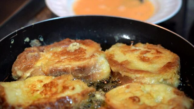 Frying bread to make"Rabanadas" (French Toasts) for Christmas
