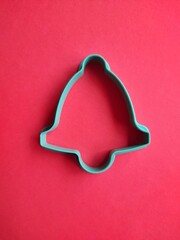 bell form for cookies on a red background, isolate