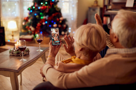 Close-up of extended family greeting during video call on Christmas. - Powered by Adobe