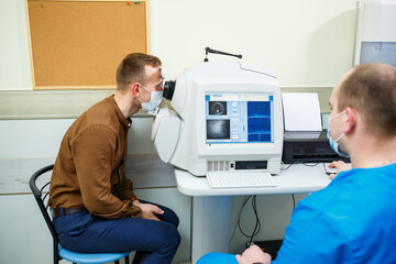 Professional medical equipment scanning the patient's eyes. The device of a modern healthcare clinic.