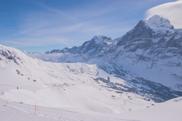 Beautiful panoramic view of snow-capped mountains in the Swiss Alps.