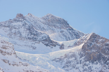 Beautiful panoramic view of snow-capped mountains in the Swiss Alps.
