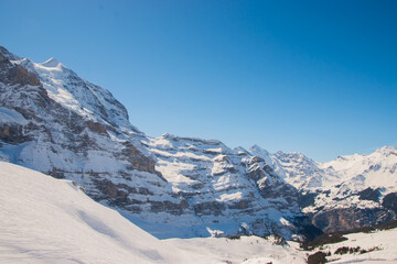 Beautiful panoramic view of snow-capped mountains in the Swiss Alps..