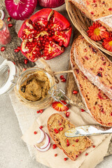 Fresh homemade chicken liver pate or paste in a glass jar with baguette slices on the serving board